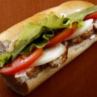 American Sub Sandwich · Fresh ham, turkey, bologna, lettuce, tomatoes, onions and mayo on a yummy hero.