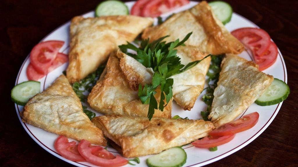 Spinach Pie · Thin filo dough filled with fresh spinach, feta cheese, and parsley fried.