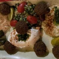 Vegetarian Grand Combo · Serves 2-3. Includes falafel, hummus, grape leaves, tabbouleh, lebeneh and baba ganoush.