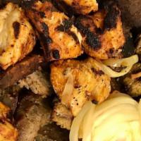 The 40 Thieves Grill Mix · Serves Two. Combination of grilled chicken, lamb kabob, beef gyro, and kufta kabob. Served w...