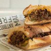 Philly Cheese Steak · Shaved Sirloin, Bell Peppers, American, Swiss & Garlic Aioli on Parker Onion Hero