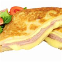 Monte Cristo Panini · Grilled Italian panini bread with melted Swiss and cheddar cheese on your choice of toppings...