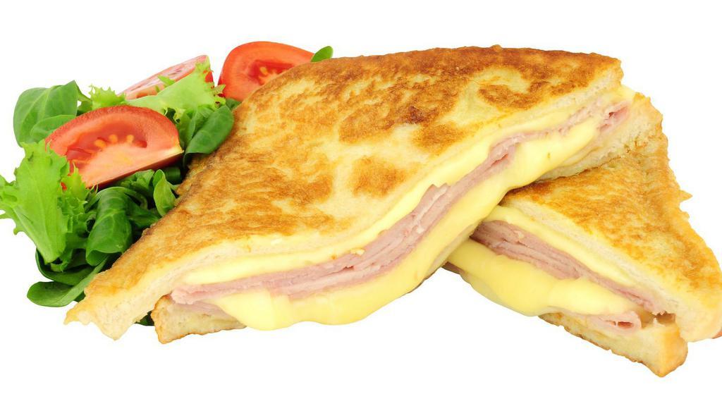 Monte Cristo Panini · Grilled Italian panini bread with melted Swiss and cheddar cheese on your choice of toppings and honey mustard.