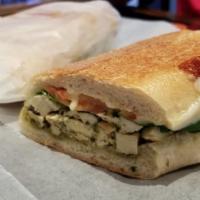 Chicken Pomodori · Grilled chicken, fresh basil, spinach, oven roasted tomatoes, and provolone cheese with pest...