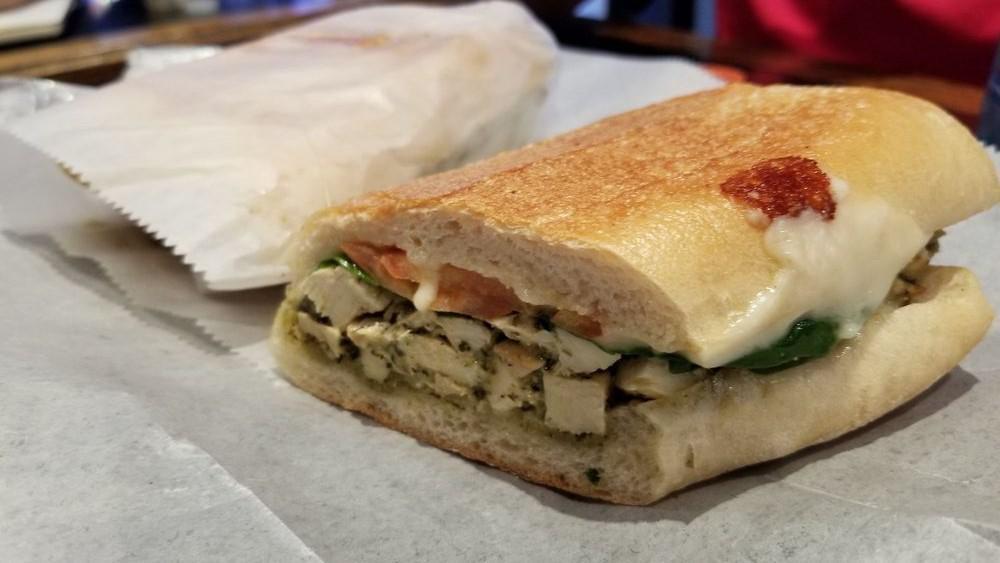 Chicken Pomodori · Grilled chicken, fresh basil, spinach, oven roasted tomatoes, and provolone cheese with pesto mayonnaise on grilled sourdough.