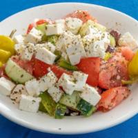 Village Salad · Tomatoes, cucumbers, peppers, olives, onions, feta cheese, oil and vinegar.