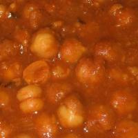 Chana Masala · Punjabi styled chickpeas cooked w/ ginger, garlic, and brown onion paste.