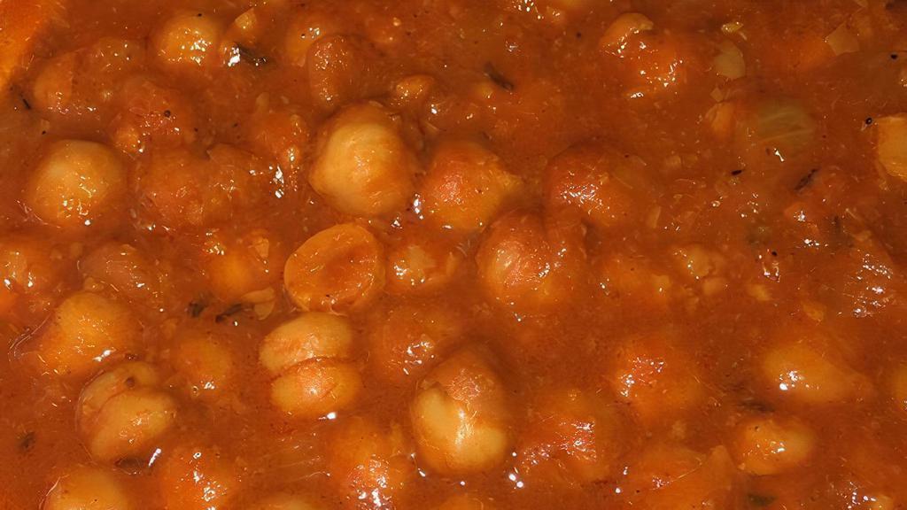 Chana Masala · Punjabi styled chickpeas cooked w/ ginger, garlic, and brown onion paste.