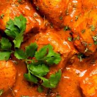 Chicken Tikka Masala · Chunks of chicken, roasted in clay oven & then folded into a mildy spiced tomato sauce.