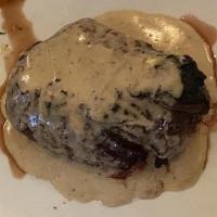 Filet Mignon À Marrare · Grilled filet mignon with a Creamy Peppercorn Sauce, served with mixed vegetables and Truffl...