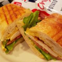 Cajun Club Sandwich · Cajun chicken, Pepper Jack cheese, crisp bacon, lettuce, tomato, and Cajun mayonnaise on toa...