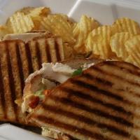 Chicken Pesto Panini · Grilled chicken, roasted red peppers, tomato, melted provolone, and pesto mayonnaise. Served...