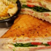 Vegetarian Panini · Spinach, tomato, roasted red peppers, melted provolone, and pesto mayonnaise. Served with ch...