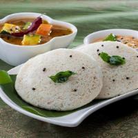 Idli (Gf, Vegan) · Steamed rice, lentils patties served with chutneys, and sambar.