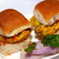 Vada Pav (2 Pc) · Batata vada served in a bun with spicy and tamarind chutneys. Two pieces.