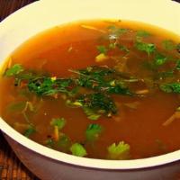 Rasam (Gf, Vegan) · Spicy lentil tamarind soup tempered with curry leaves.