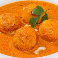 Malai Kofta · Dumplings of cottage cheese, potatoes, sauteed in a rich sauce and saffron. All curries are ...