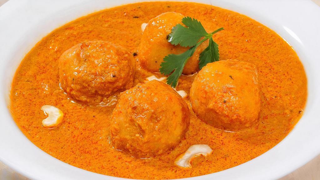 Malai Kofta · Dumplings of cottage cheese, potatoes, sauteed in a rich sauce and saffron. All curries are served with basmati rice.