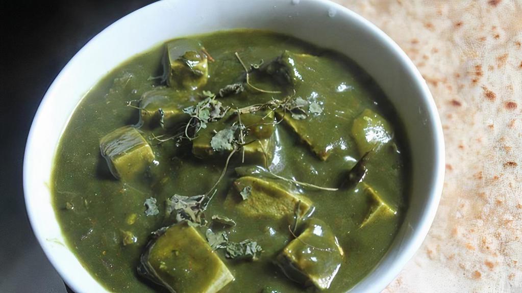 Palak Tofu (Gluten-Free, Vegan) · Tofu simmer in a smooth spinach puree with cumin seeds, ground coriander, turmeric, and curry powder.