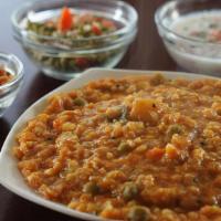 Bisi Bele Bhath (Has Peanuts) · Kamataka dish which is spicy hot lentil rice and peanuts. Served with papad and achar.