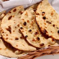Tandoori Roti · Flatbread made with whole wheat and traditionally cooked in tandoor