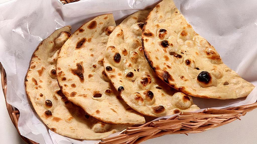 Tandoori Roti · Flatbread made with whole wheat and traditionally cooked in tandoor