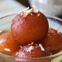 Gulab Jamun · Indian dessert. Spongy milky dumplings soaked in rose scented syrup.