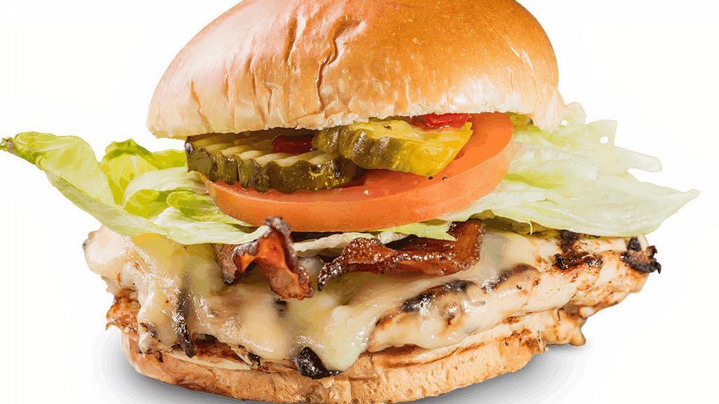 Hickory Chicken Sandwich · Marinated, grilled chicken breast topped with Monterey Jack cheese and bacon.. Served with choice of 1 side and spicy Hell-Fire Pickles.