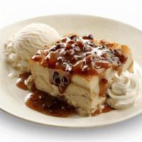 Dave'S Award-Winning Bread Pudding · Bread pudding and pecan praline sauce served warm with vanilla bean ice cream and whipped cr...
