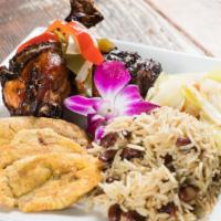 Jerk Chicken · Green plantains rice and peas cabbage.