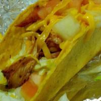 Grilled Chicken Taco · Served with iceberg lettuce, tomato and topped with Cheddar cheese.