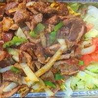Lamb Over Rice · Lamb with cooked onions,peppers over basmati rice with side of mix salad.