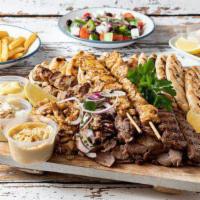 Mix Gyro (Chiken&Lamb) · Chicken mix with lamb meat ,cooked onions.,papers. Mix salad over pita bread. It basic with ...