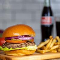 The Double American Burger · Two American beef patties, lettuce, tomato, onion, and mayo on a warm classic bun.