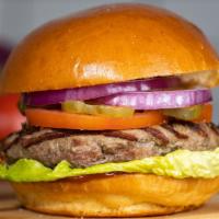 The American Burger · American beef patty, lettuce, tomato, onion, and mayo on a warm classic bun.