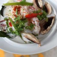 Tom Kha Soup · Spicy. Choice of protein simmered in a thick and rich coconut milk base soup flavored by lim...