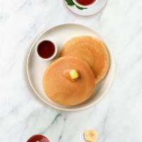 Classic Pancakes · Fluffy pancakes cooked with care and love served with butter and maple syrup. Three pieces.