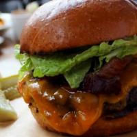 Signature Grill House Burger · Black angus blend, bacon, cheddar,. romaine, tomato, red onion, 581 sauce.