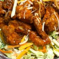 Buffalo Chicken Salad · Fried boneless chicken tossed in buffalo sauce, romaine, diced carrots & celery, cheddar, bl...