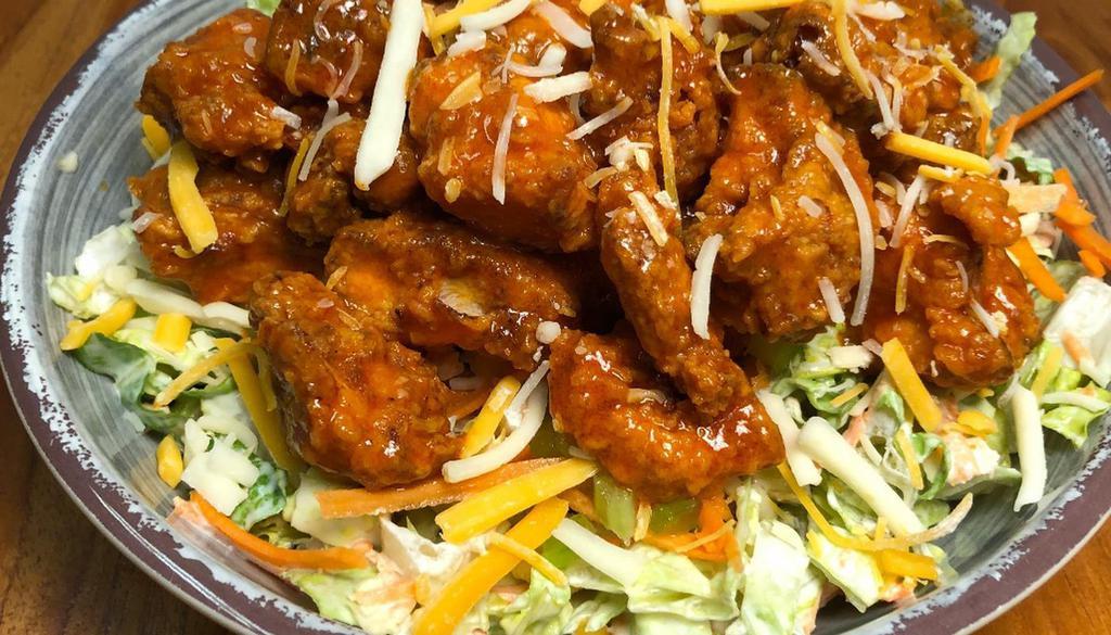 Buffalo Chicken Salad · Fried boneless chicken tossed in buffalo sauce, romaine, diced carrots & celery, cheddar, blue cheese dressing.