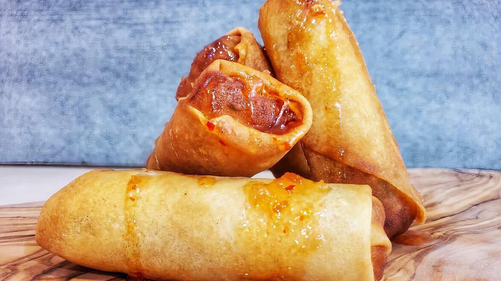 Crispy Spring Rolls · Cabbage, carrots glass noodles served with sweet chili sauce. 4pc.