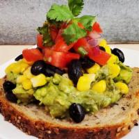 Tex Mex Avocado Toast · Smashed avocado, jalapeño, black beans & corn salsa on multigrain toast. (VEGAN)