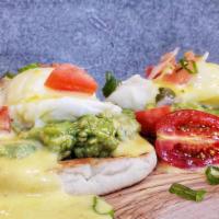 Avocado Benedict · Poached eggs, smashed avocado, English muffin, pico de gallo, hollandaise sauce, served with...