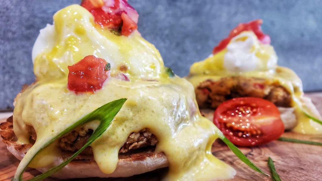 Crab Cakes Benedict · Poached eggs, English muffin, pico de gallo, hollandaise sauce, served with salad & skillet potatoes.