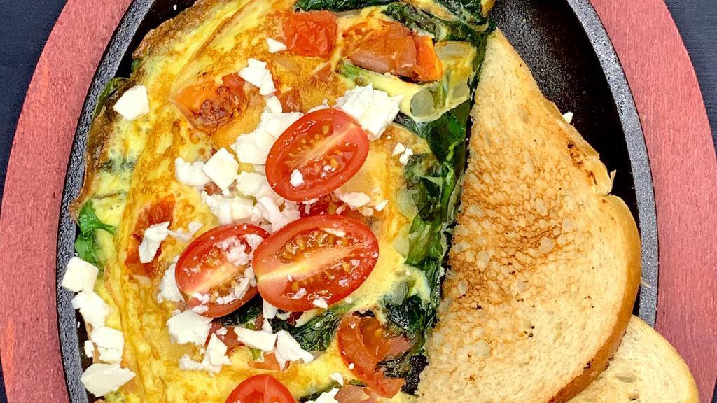Greek Omelette · Tomatoes, spinach, onions  & feta cheese.