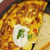 Chorizo Avocado Omelette  · Chorizo sausage, avocado, onions, red peppers, & pepper jack cheese topped with sour cream.