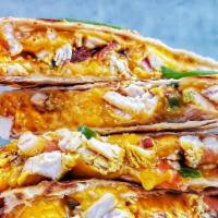 Grilled Chicken Quesadilla · Grilled chicken breast, bacon bits, cheddar cheese served with pico de gallo & sour cream