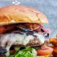 Steakhouse Burger Deluxe  · 8oz angus beef with mushrooms, onions, bacon, swiss cheese, lettuce, tomatoes onions, pickle...