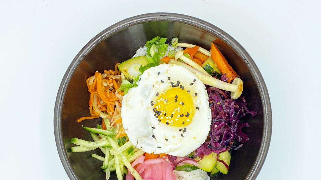 Vegetable Bibimbap · Assorted vegetables(zucchini, carrots, kale, mushrooms), pickled vegetables served over jasmine rice, sunny side up egg & spicy chili sauce on the side.
