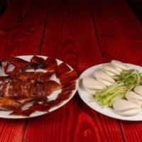 Peking Duck · w. scallion, cucumber, bun & hoisin sauce.